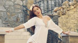 White dress fashion girl standing at stairs wallpaper thumb