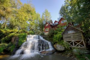 Beautiful Waterfalls By A Red House wallpaper thumb