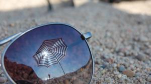 Lost sunglasses in the sand wallpaper thumb