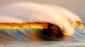 Wave reflecting the evening light wallpaper thumb