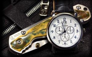 Folding knife and swiss watches wallpaper thumb