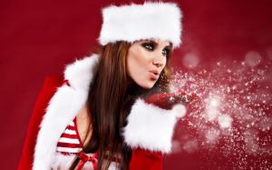 Christmas girl blowing snowflakes wallpaper thumb