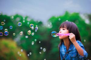 Child Girl Blowing Bubbles wallpaper thumb