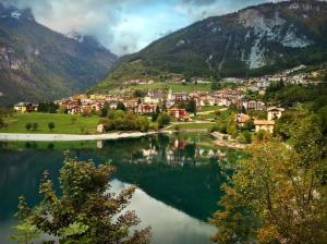 Italy, Molveno, mountains, houses, lake, clouds wallpaper thumb