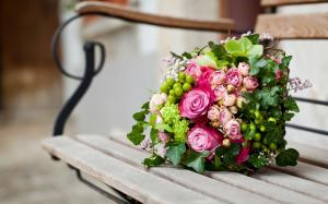Bouquet of pink rose in a bench wallpaper thumb