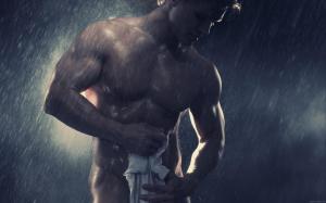 Muscular man under the shower wallpaper thumb