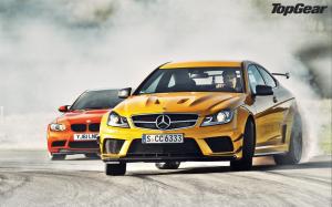 Mercedes-Benz C63 AMG yellow and BMW M3 GTS red supercar wallpaper thumb