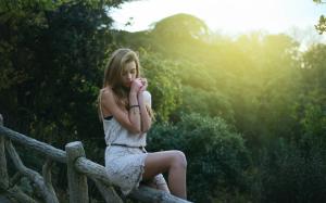 Beautiful blonde girl in dream, sitting at fence, morning wallpaper thumb