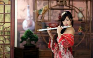 Red dress girl, playing flute wallpaper thumb