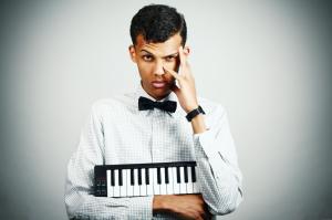 Stromae with a piano wallpaper thumb
