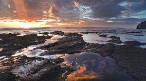 Sunset Rocks Stones Ocean Beach Clouds HD wallpaper thumb