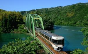 Train Crossing A Bridge Over A Beautiful River wallpaper thumb