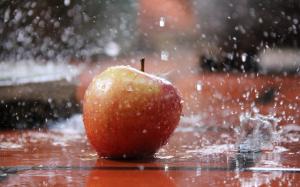 Red apple in the rain, water splash wallpaper thumb