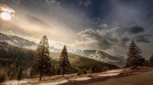 Romania, trees, mountains, snow, sun, clouds, road wallpaper thumb