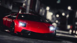 Red Lamborghini supercar front view, city night wallpaper thumb