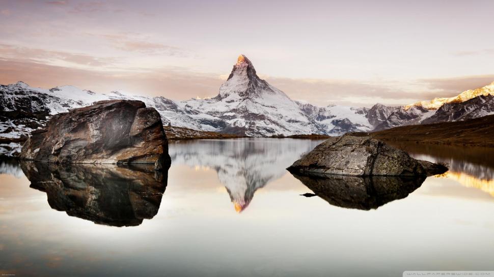 Matterhorn Reflected In An Alpine Lake wallpaper,reflection HD wallpaper,mounatain HD wallpaper,lake HD wallpaper,rocks HD wallpaper,nature & landscapes HD wallpaper,1920x1080 wallpaper
