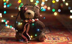 Stuffed bear covered in lights wallpaper thumb