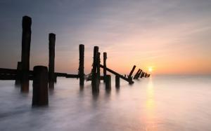 Sunrise Over Broken Pier In A Misty Sea wallpaper thumb