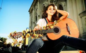 Beautiful brunette with a guitar wallpaper thumb