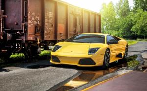 Lamborghini Murcielago LP640-4 yellow supercar, train wallpaper thumb