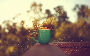 A cup of coffee, drops splash, blurred background wallpaper thumb
