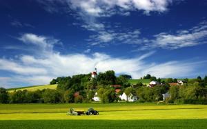 Picturesque Village and Tractor wallpaper thumb