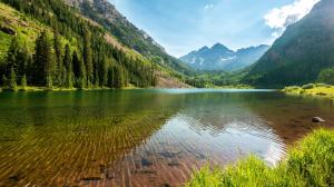 Lake, mountains, trees, grass, sky, water reflection wallpaper thumb