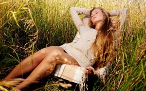 Girl relaxing in grass wallpaper thumb