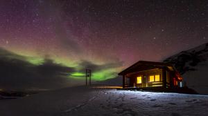Aurora Borealis Northern Lights Night Green Stars Cabin House Snow Winter HD wallpaper thumb