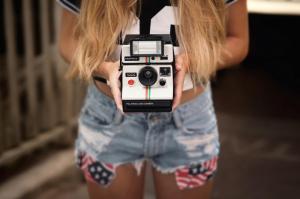 polaroid, camera, girl, hands, shorts wallpaper thumb