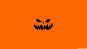 Scary Halloween Face on Orange Background wallpaper thumb