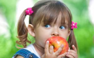 Cute little girl eating apple wallpaper thumb