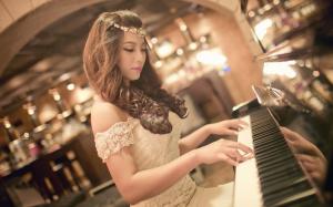 Pretty asian girl play piano wallpaper thumb