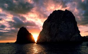 Sunset, sea, coast, island, sky, clouds, cliff, birds wallpaper thumb