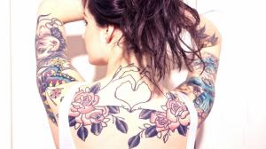 Brunette showing tattoos wallpaper thumb