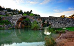 Stone bridge, river, arch, grass, dusk wallpaper thumb