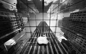 Apple logo in middle of building under the rain wallpaper thumb