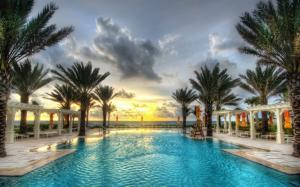 Palm trees, swimming pool, resort, sunset, clouds, sea wallpaper thumb
