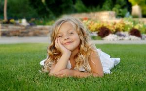 Little girl on grass wallpaper thumb