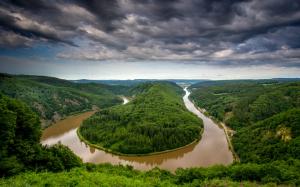Germany, Saarland, river bend, water after rain, trees, hills wallpaper thumb