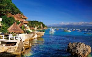 Resort area, coast, sea, huts, sailboats, blue water and sky wallpaper thumb