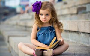 Cute little girl reading a book wallpaper thumb
