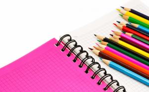 Colored pencils on a notebook wallpaper thumb