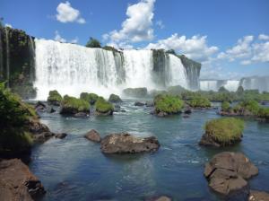 Brazilian Iguazu Falls, stones, grass, blue sky, clouds wallpaper thumb