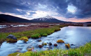 Wetland landscape, sunset, river, snow-capped mountains, cloudy sky wallpaper thumb