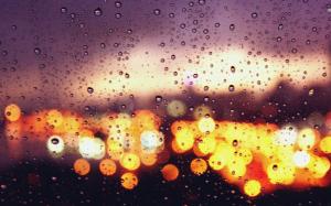 City lights behind the rainy window wallpaper thumb