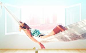 Woman resting in a hammock wallpaper thumb