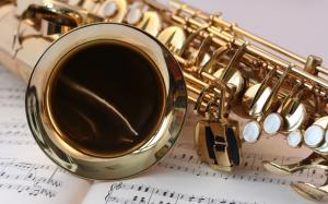 Saxophone close-up, music stave wallpaper thumb