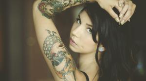 Brunette with arm tattoo wallpaper thumb