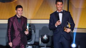 Lionel Messi and Cristiano Ronaldo smile during the FIFA Ballon d'Or Gala 2014 wallpaper thumb